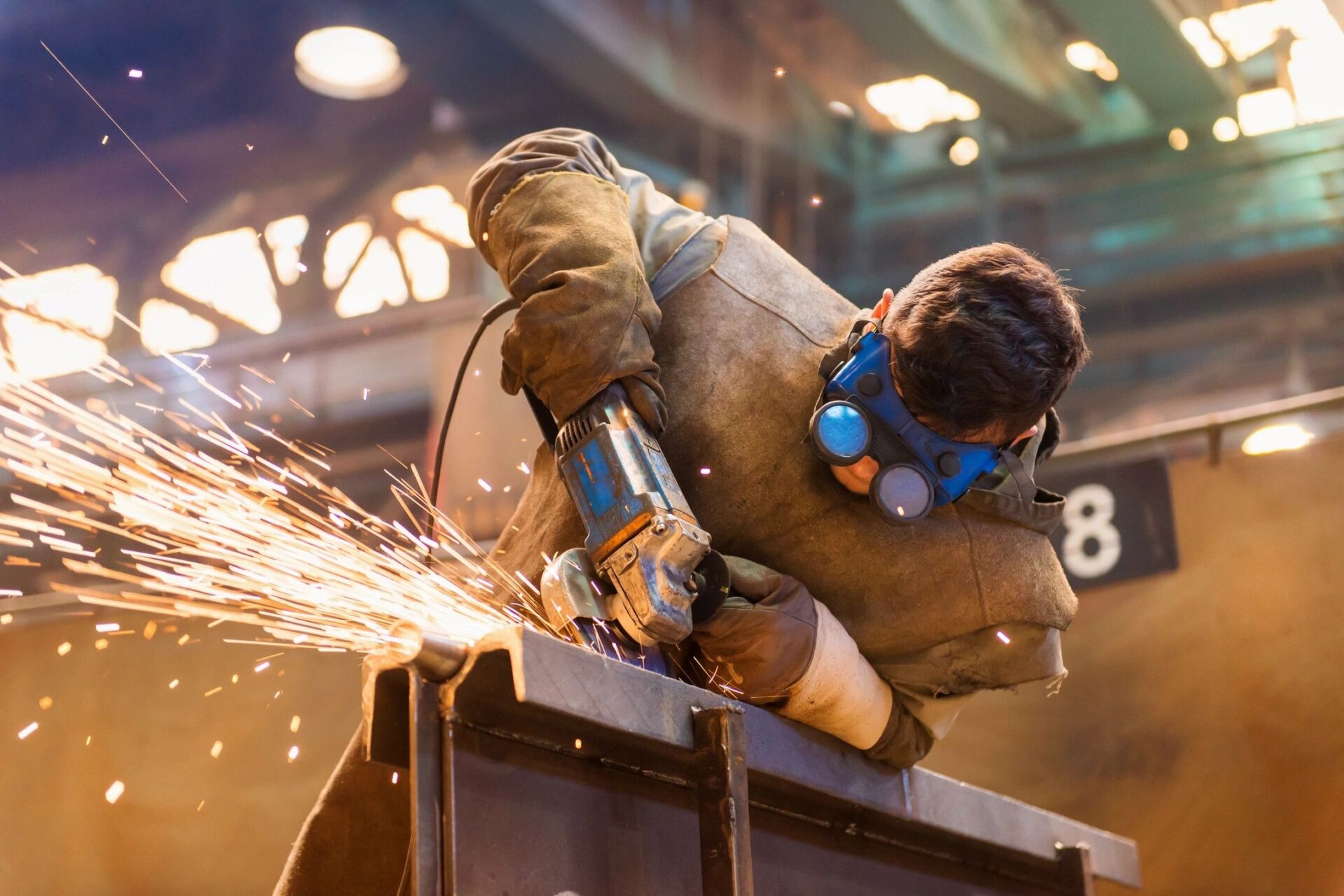 Man Cutting Iron
